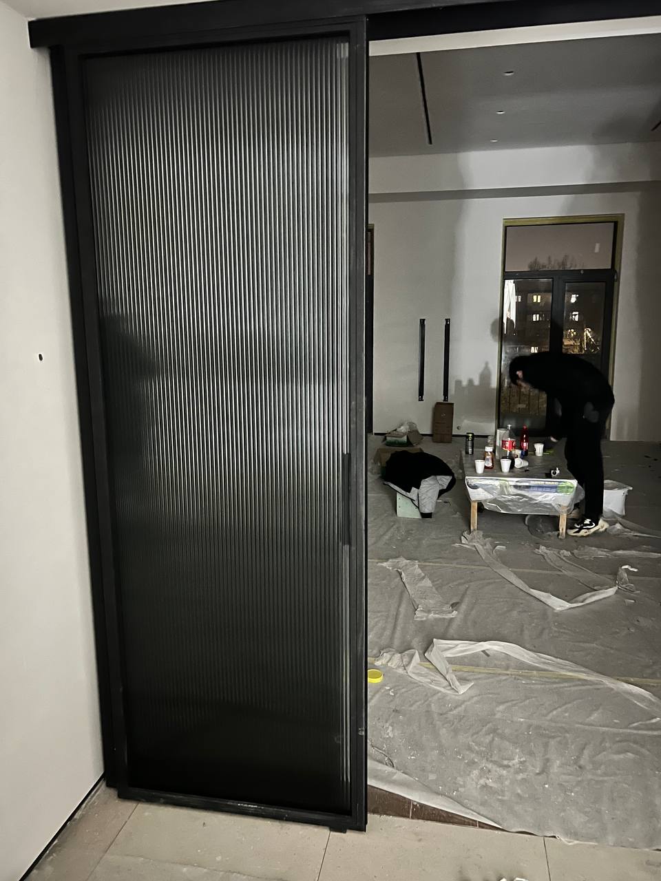 Reed glass sliding door with black profile